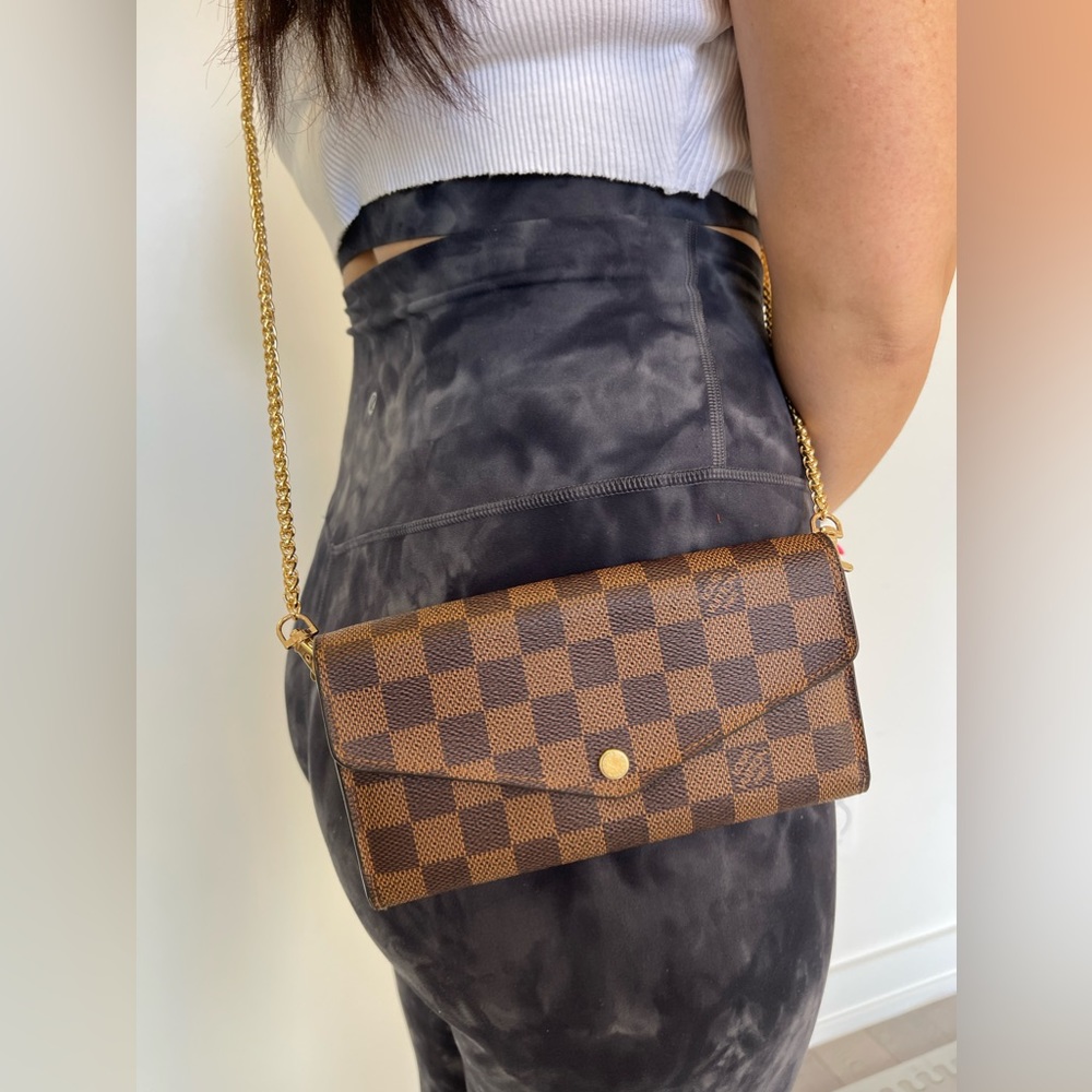 Authentic Louis Vuitton Ebene Sarah wallet with a crossbody strap and box!